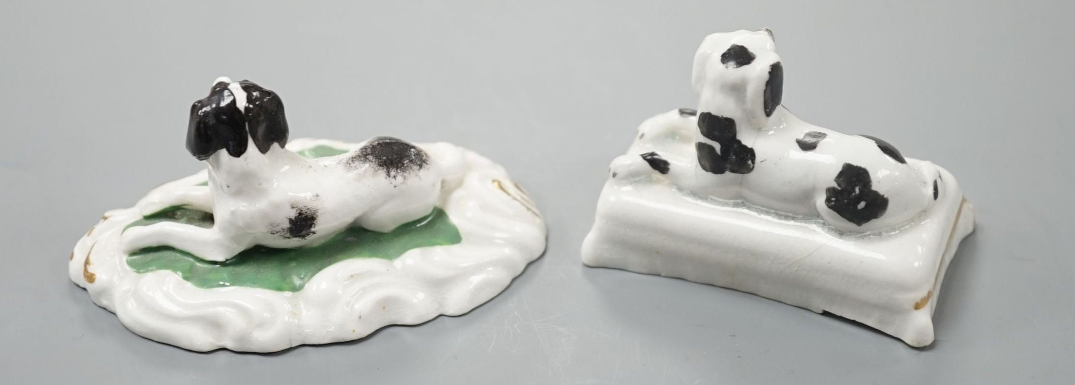 Two Staffordshire porcelain models of recumbent king Charles spaniel‘s, c.1835-50, largest 8.2 cm long, Cf. Dennis G.Rice Dogs in English porcelain, colour plate 146., Provenance: Dennis G.Rice collection